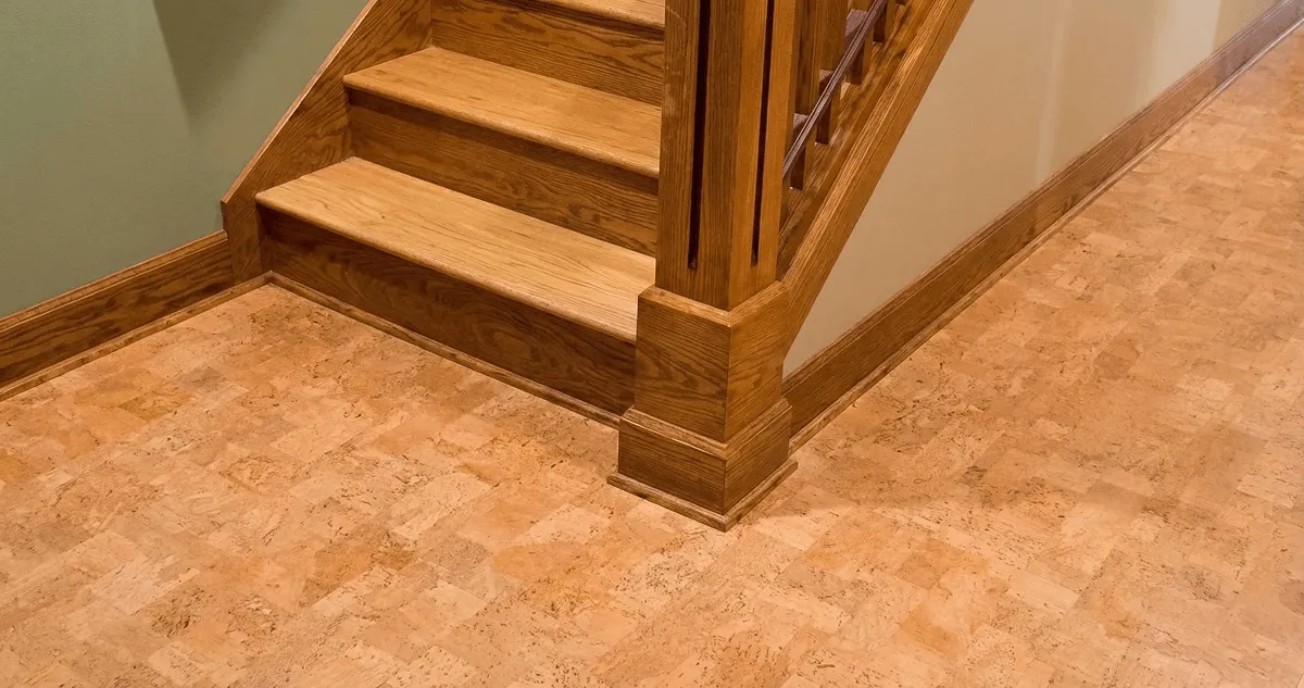 End of a staircase with cork flooring in San Antonio, TX