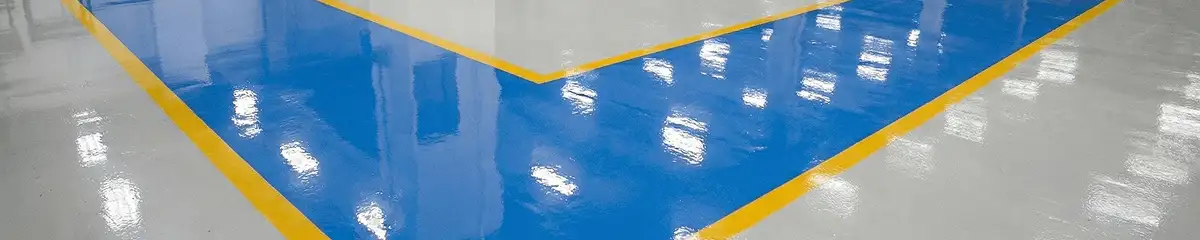 A factory floor professionally covered and marked with epoxy flooring in San Antonio, TX