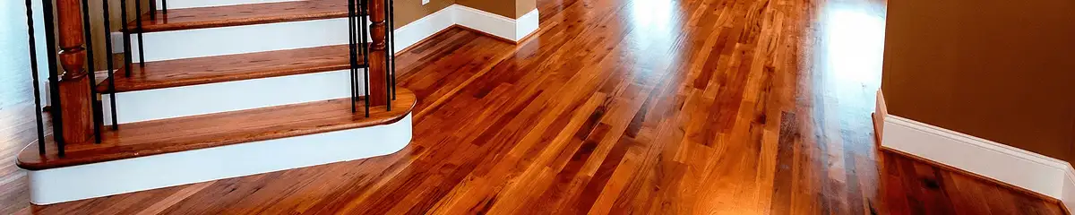 Base floor of a staircase with professionally restored wood flooring in San Antonio TX