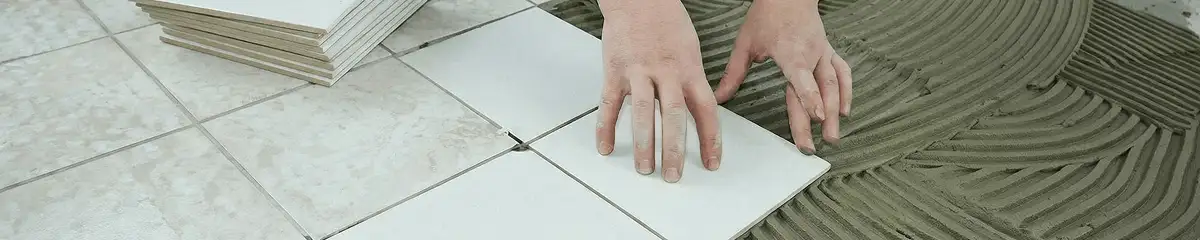 Professional installing white tile floors in San Antonio, TX