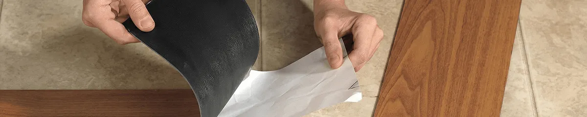A professional installing vinyl flooring in San Antonio, TX