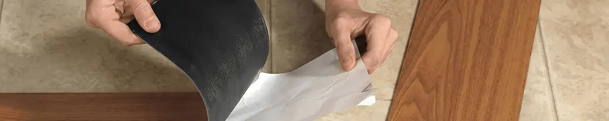 A professional installing vinyl flooring in San Antonio, TX