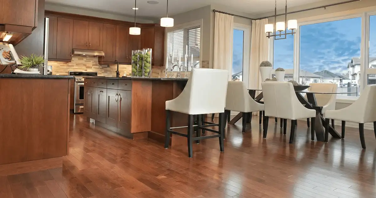 A modern kitchen with professionally installed wood flooring in San Antonio, TX